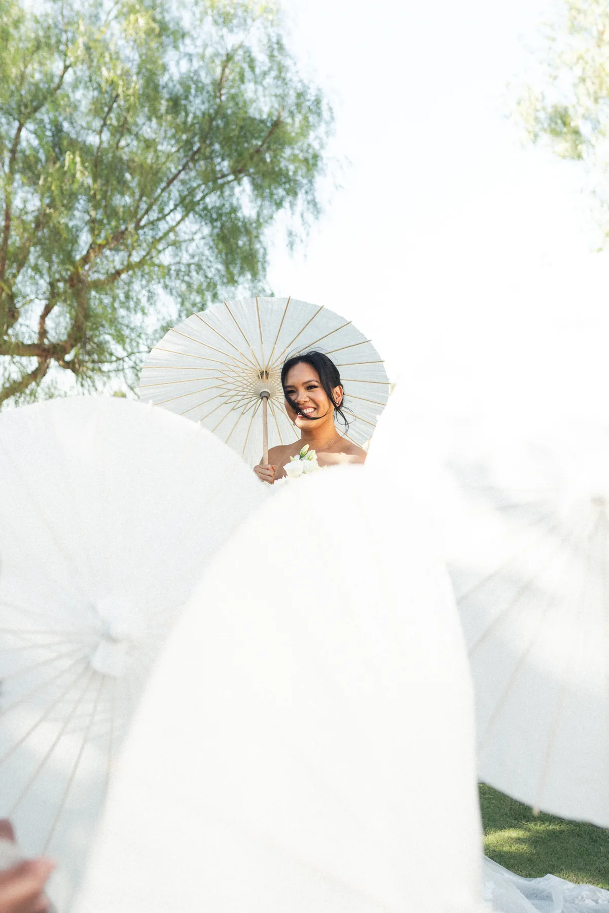 Bride in a flowing white dress outdoors