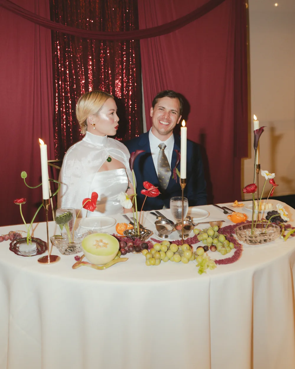 Newlyweds seated at their wedding reception