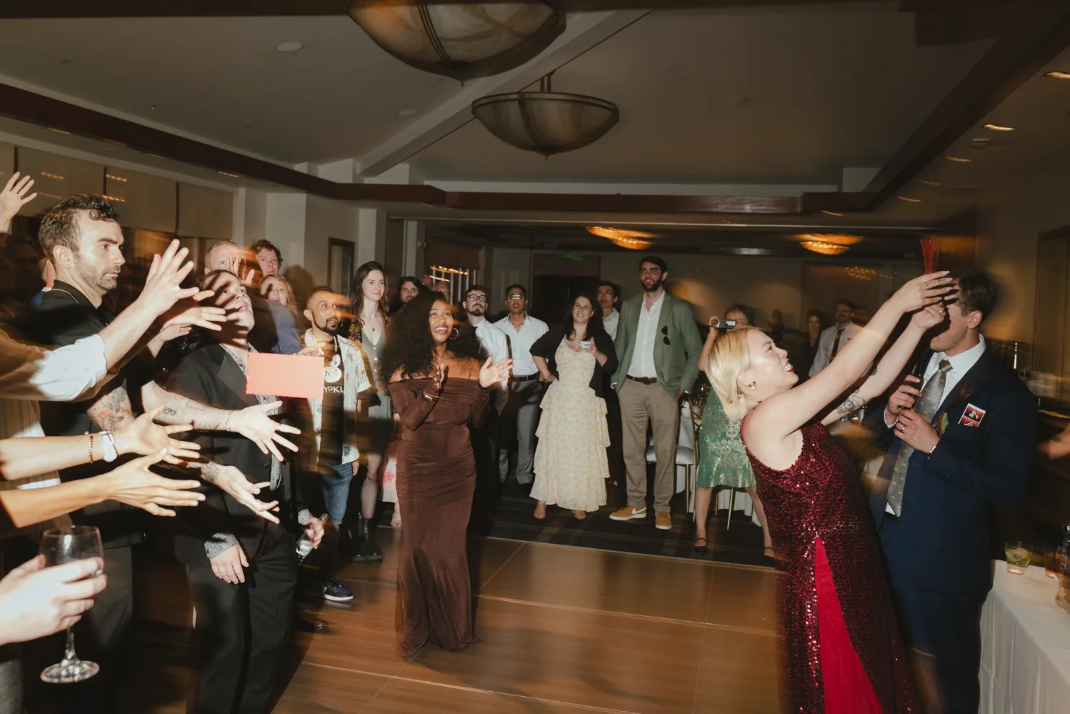 Wedding guests celebrating on the dance floor