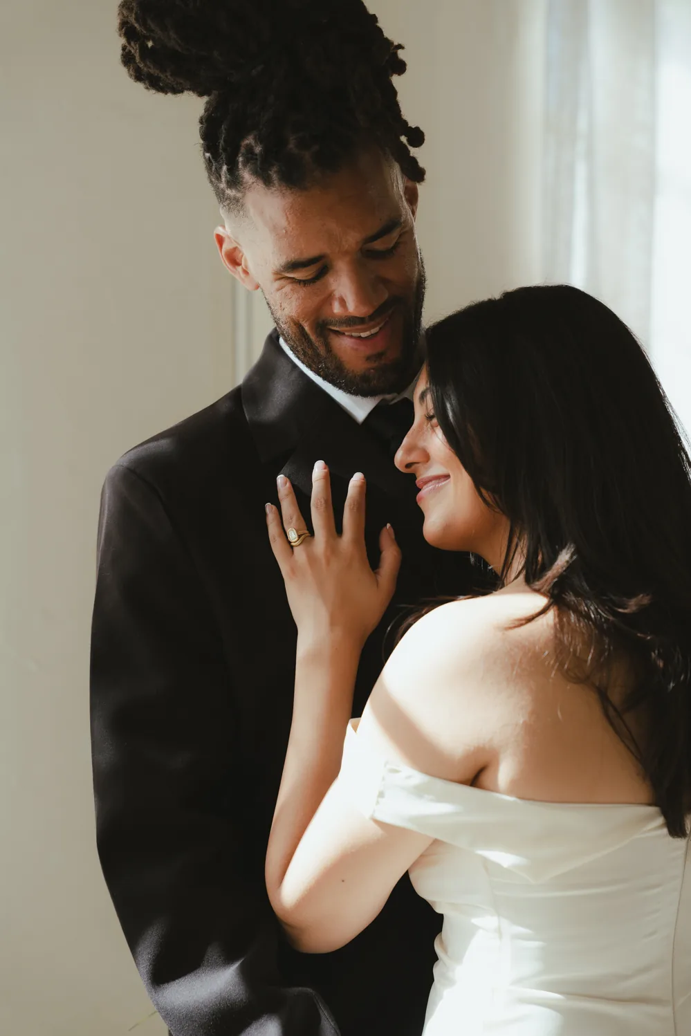 Couple holding each other in a wedding portrait