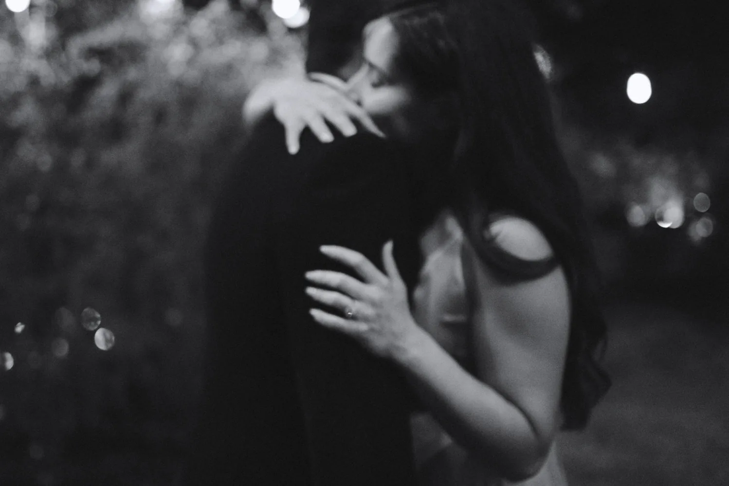 Couple embracing in a black and white evening portrait