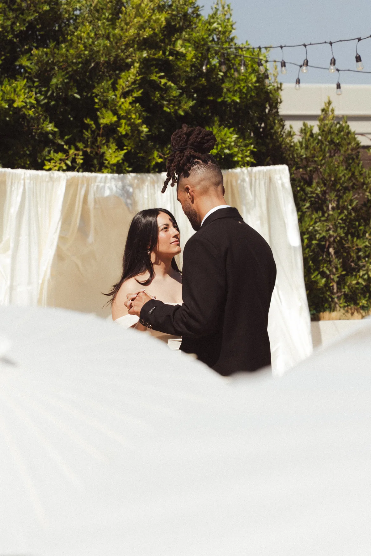 Couple together during an outdoor wedding ceremony