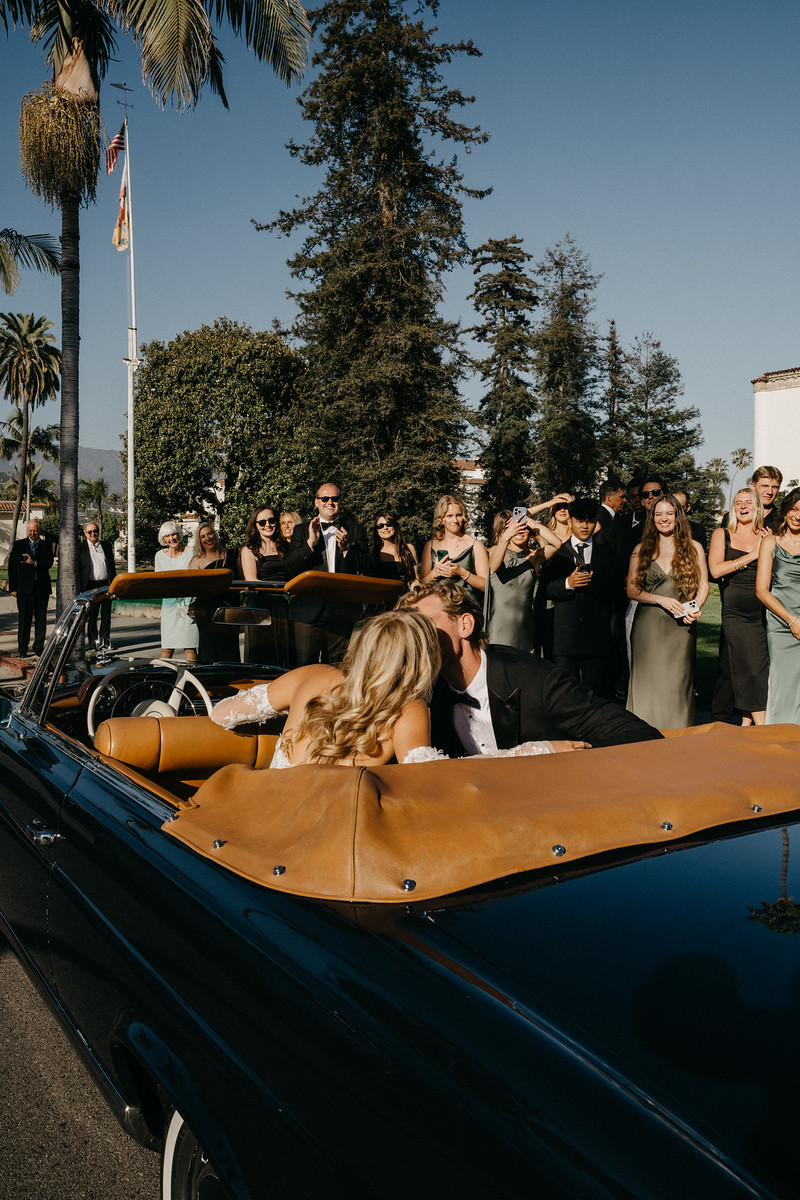 Wedding party in convertible