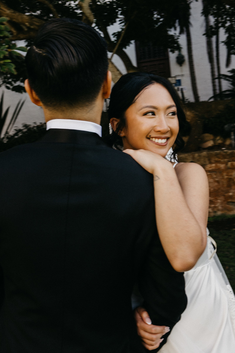 Bride smiling over shoulder