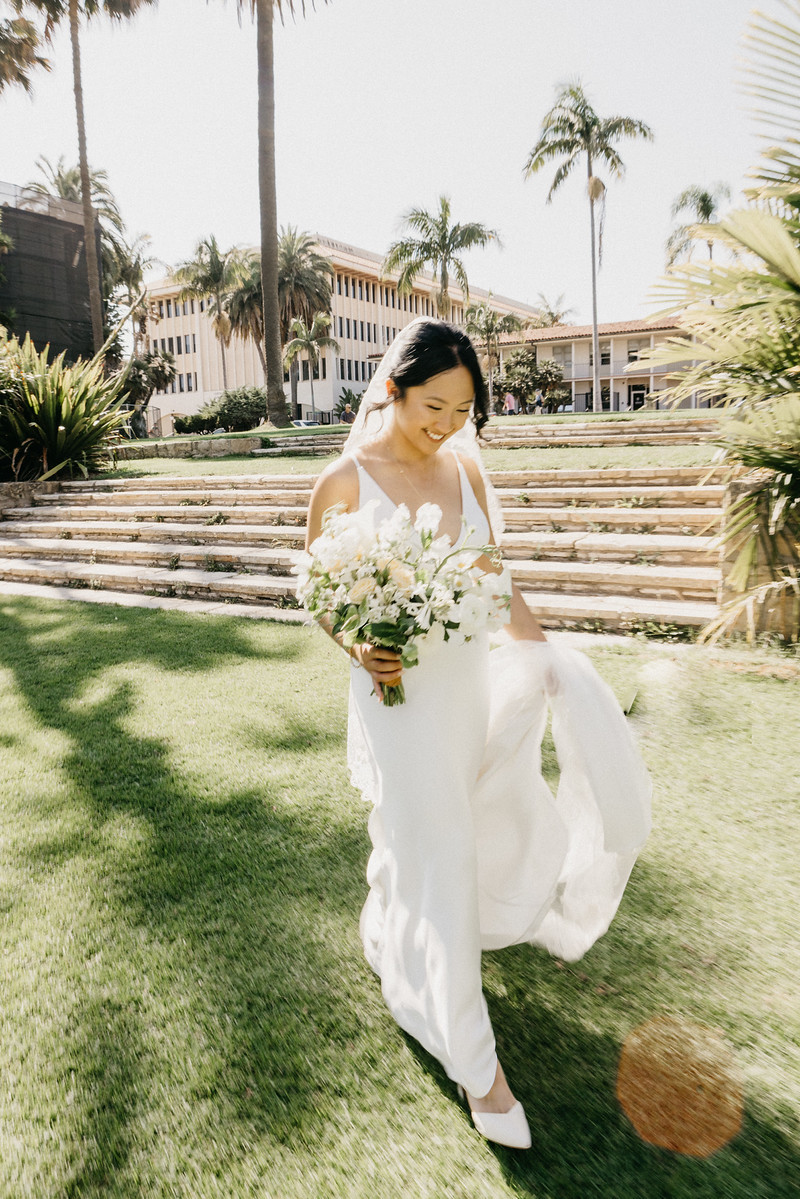 Bride walking with bouquet