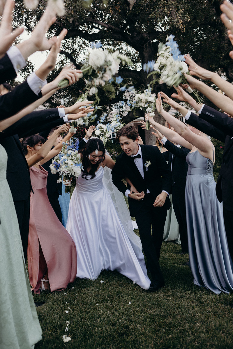 Guests celebrating around the couple